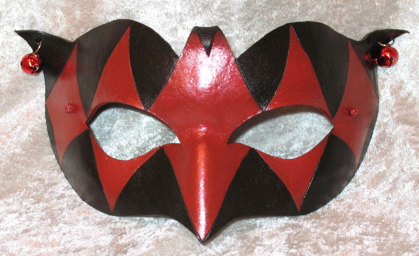 Red & black Demure Jester mask.